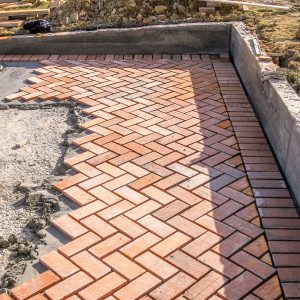 orange-brick-paving-stones-construction-process-min